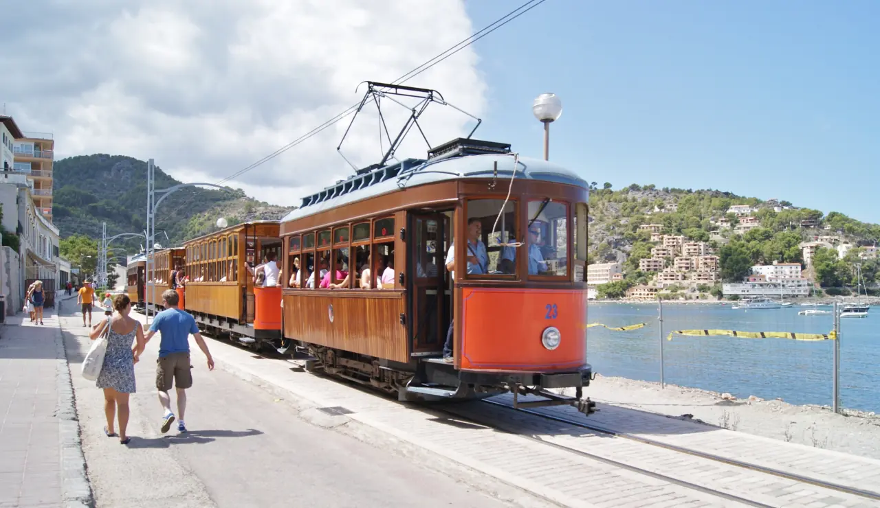 Tram 23 leading 4-car train in Port de Sóller, next to the bay